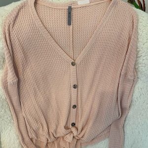 Pink, light, button down sweater from Jolie.